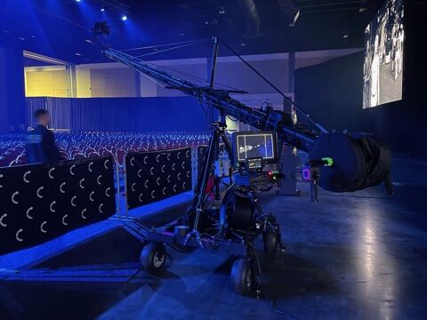 West Palm Beach, Florida, July 2024 — Jimmy Jib crane against the lit stage.
