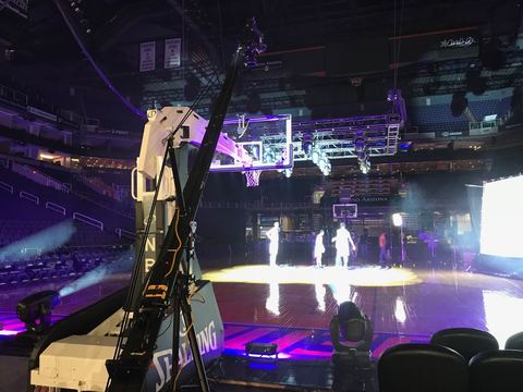 Phoenix Suns home opener (2017) — Crane — the court from the back of a darkened arena.