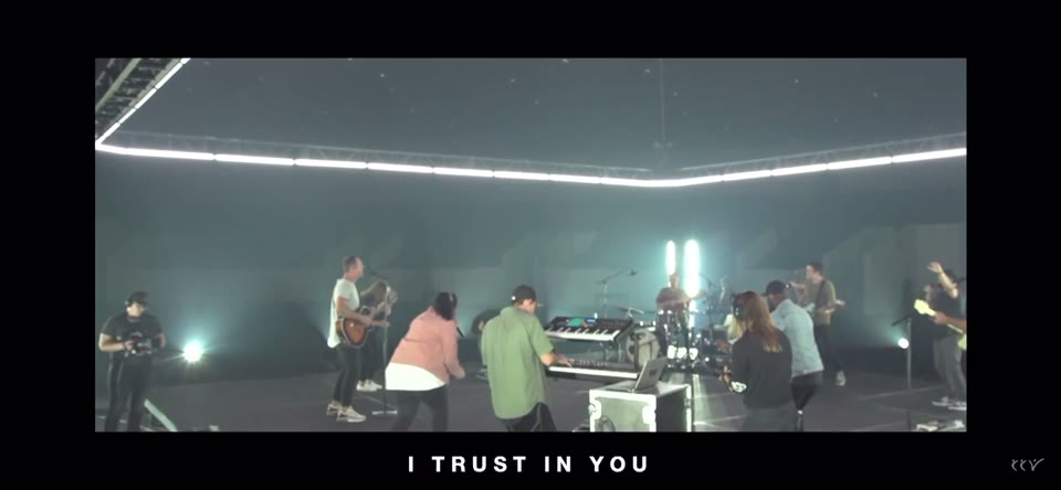 CCV Church music recording (2020) — Jib. The band mid-song on the stage, with the recording's own lyric line at the foot of the frame.